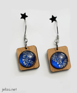 Blue space earrings on cherry wood rectangles
